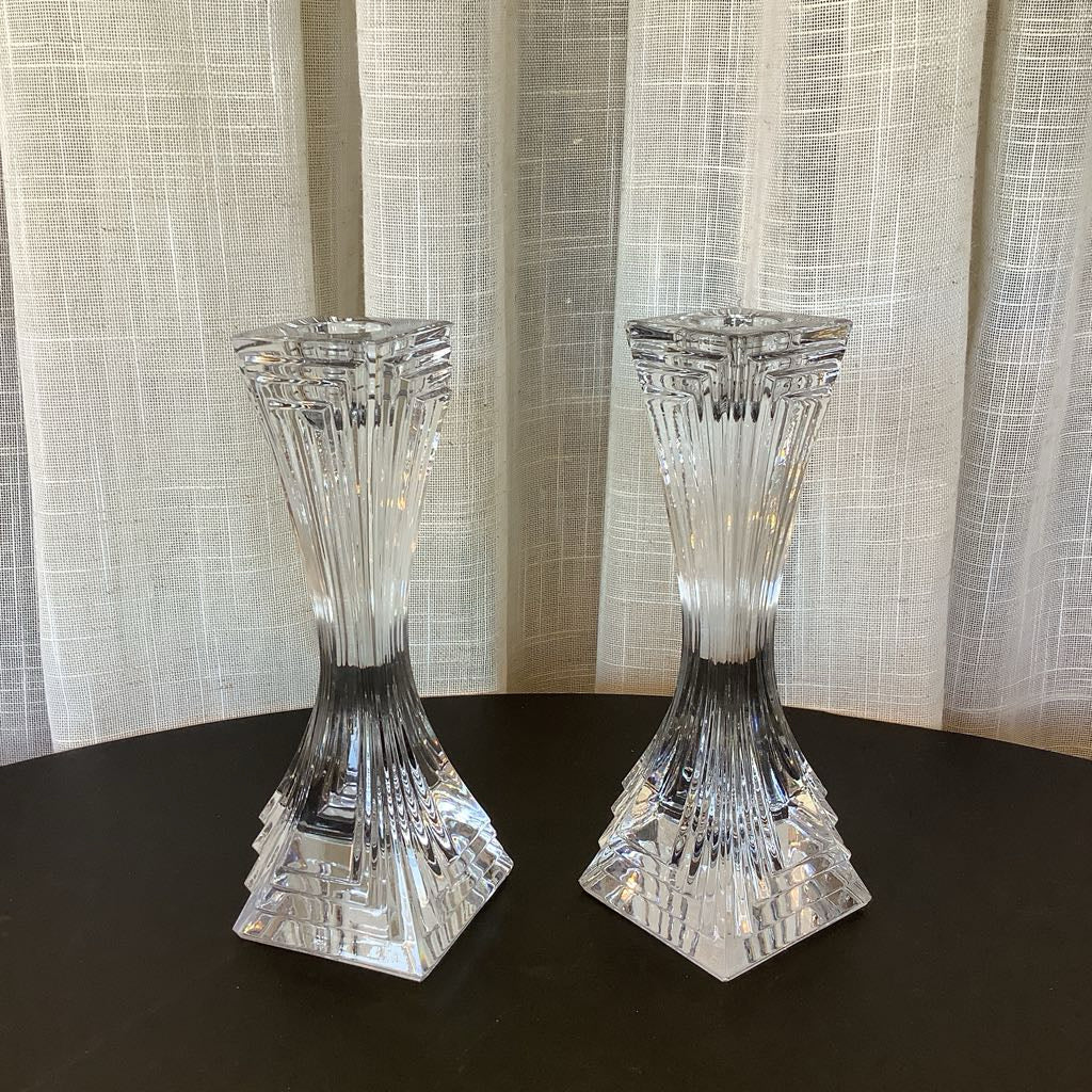 Crystal candle sticks against a neutral background.
