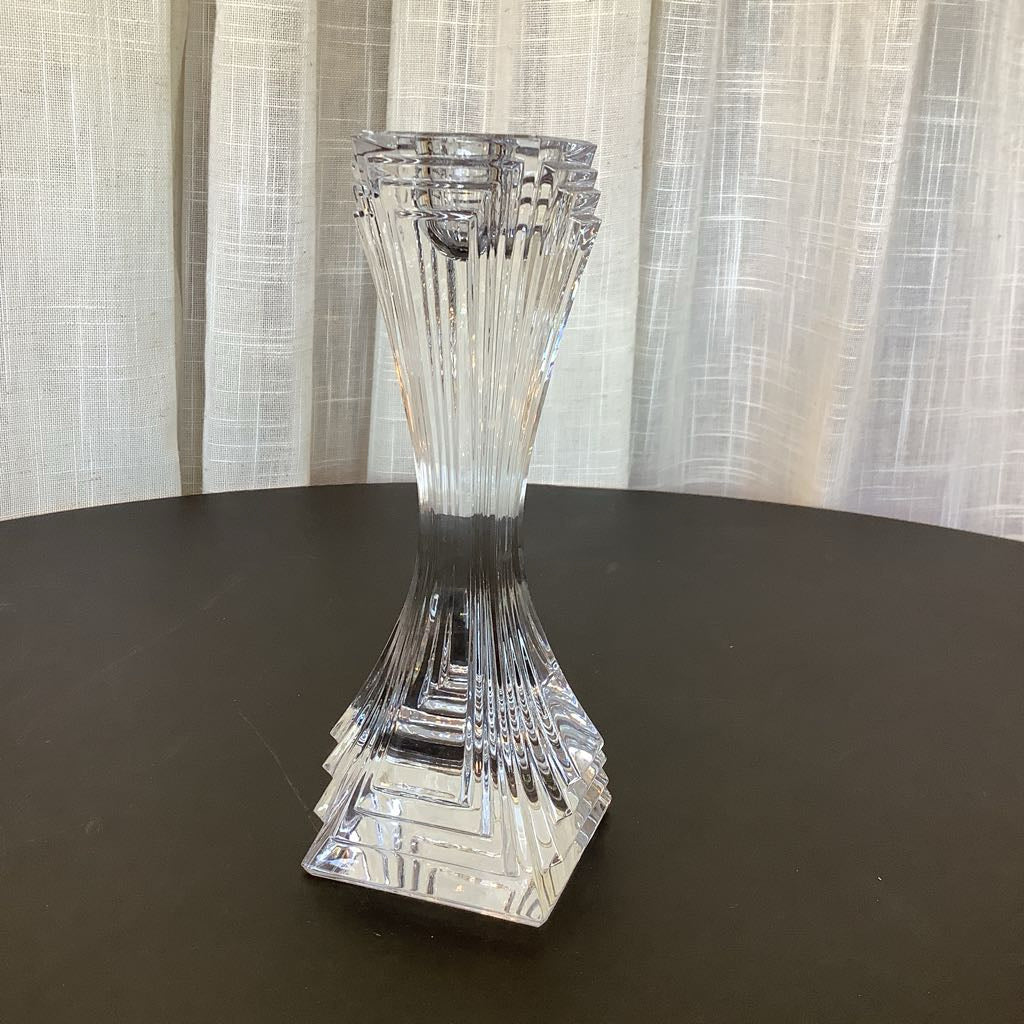 Crystal candle sticks against a neutral background.