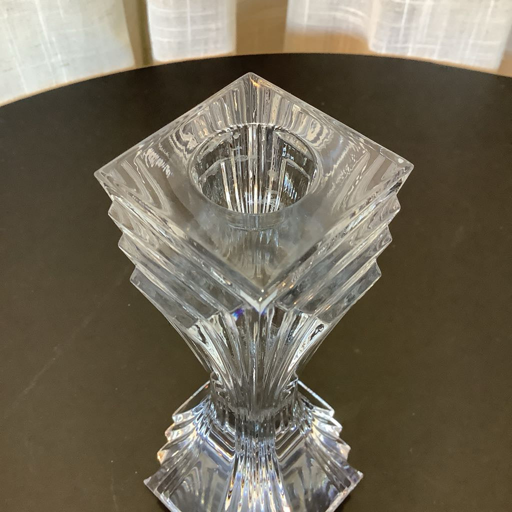 Crystal candle sticks against a neutral background.