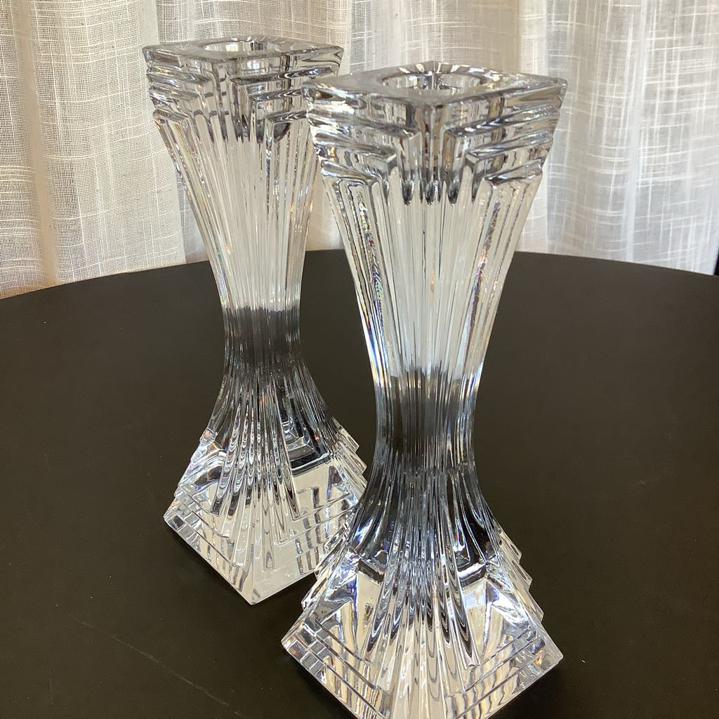 Crystal candle sticks against a neutral background.