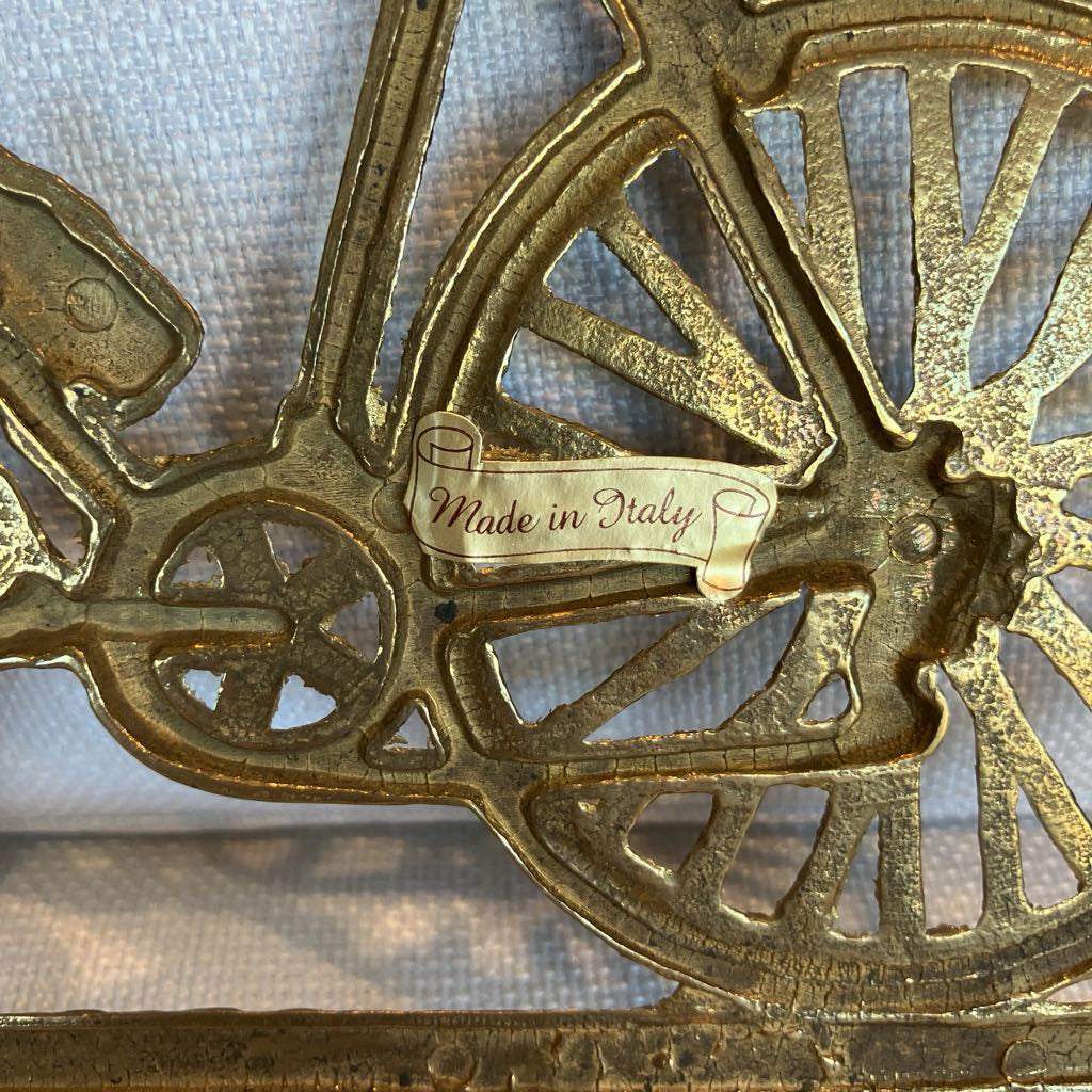 Made in Italy sticker on the back of a bronze bicycle wall hook