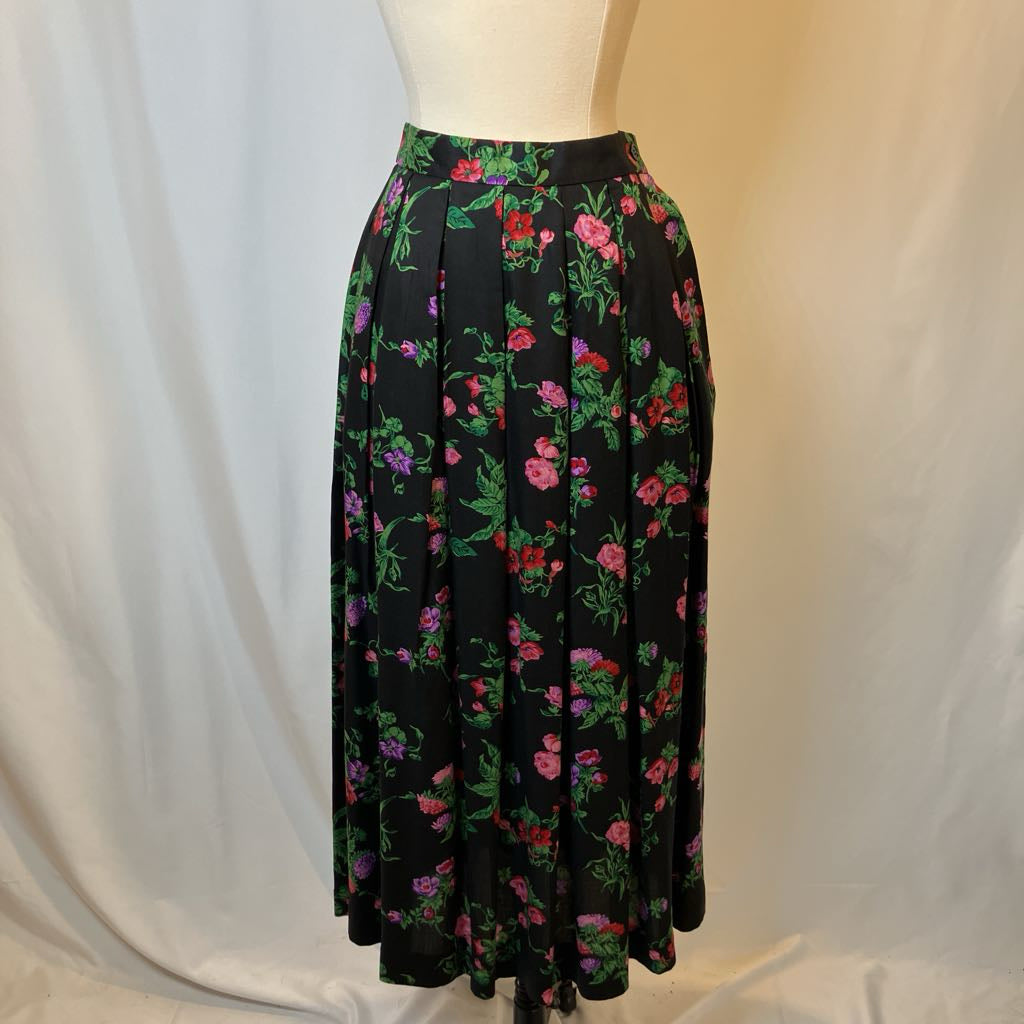 Floral skirt on a mannequin against a plain background