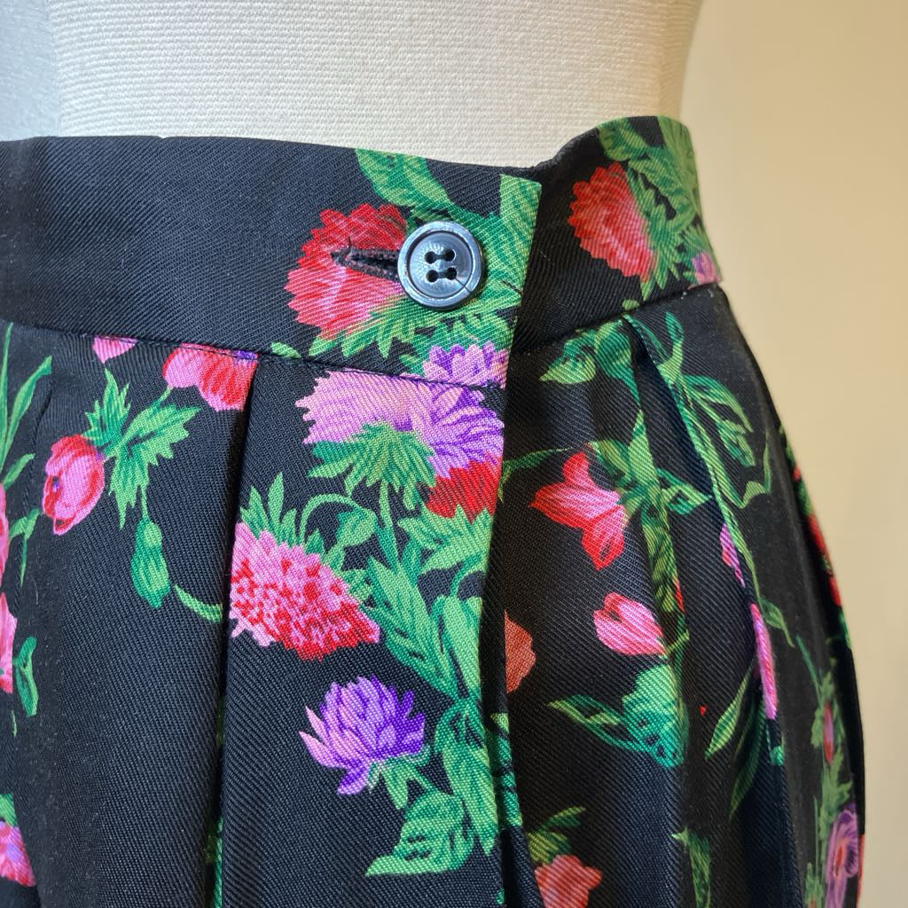 Floral patterned fabric on a mannequin with a button detail.