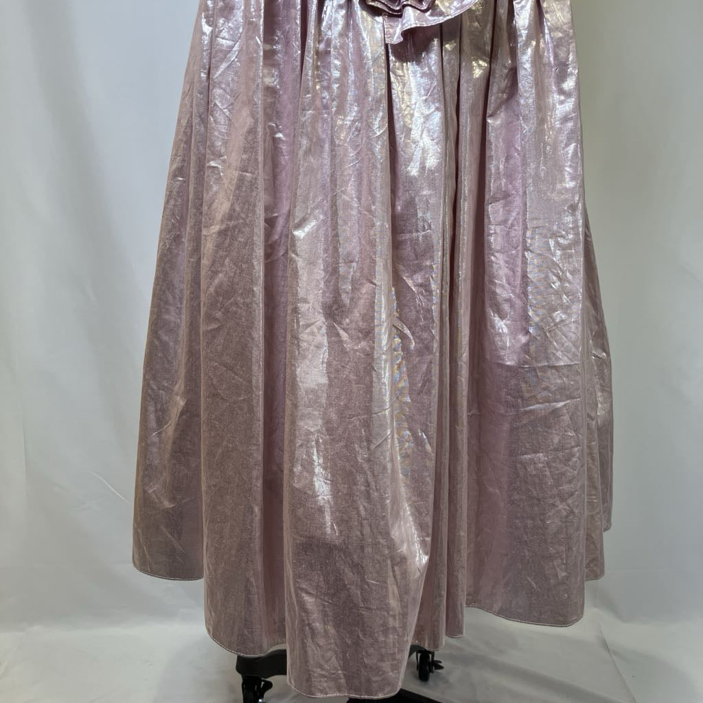 Pink metallic dress on a mannequin against a white background