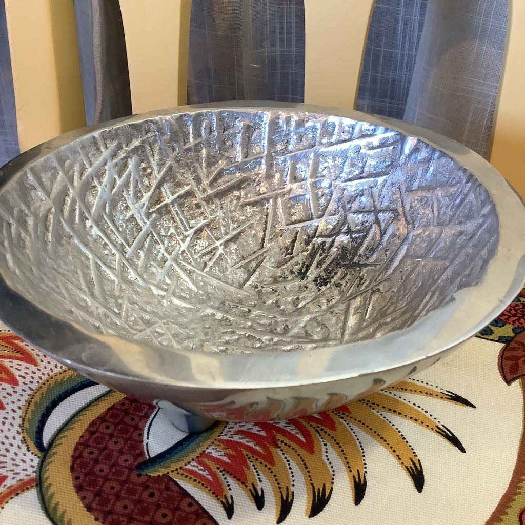 Side view looking into pewter bowl. Shows texture of inside of bowl.