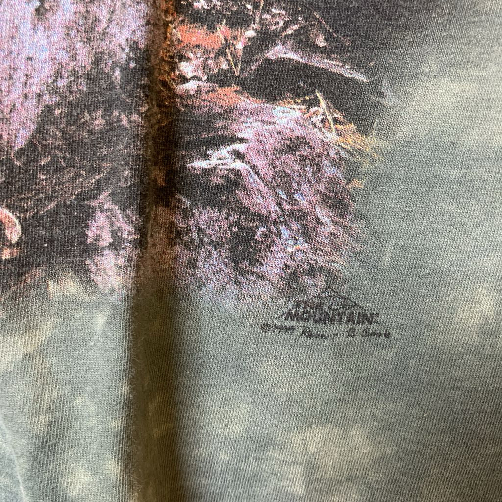 Close-up of a textured surface with a logo and text in the corner.