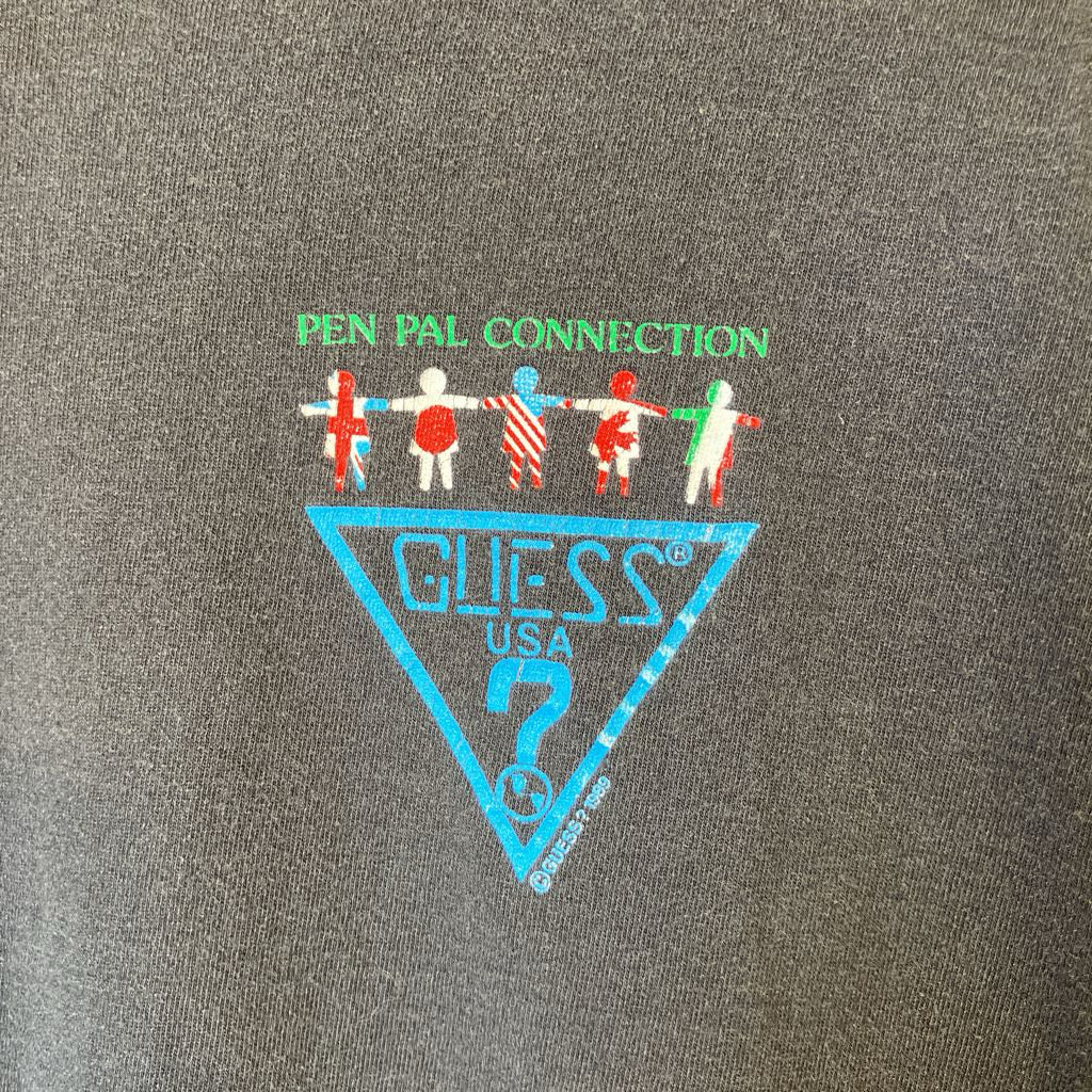 Guess logo with 'Pen Pal Connection' text and design on a gray background