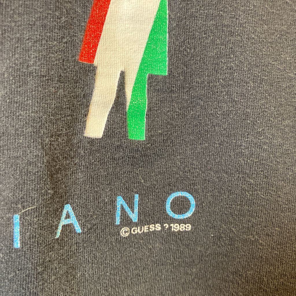 Vintage Guess t-shirt with colorful graphic and '1989' text on a gray background