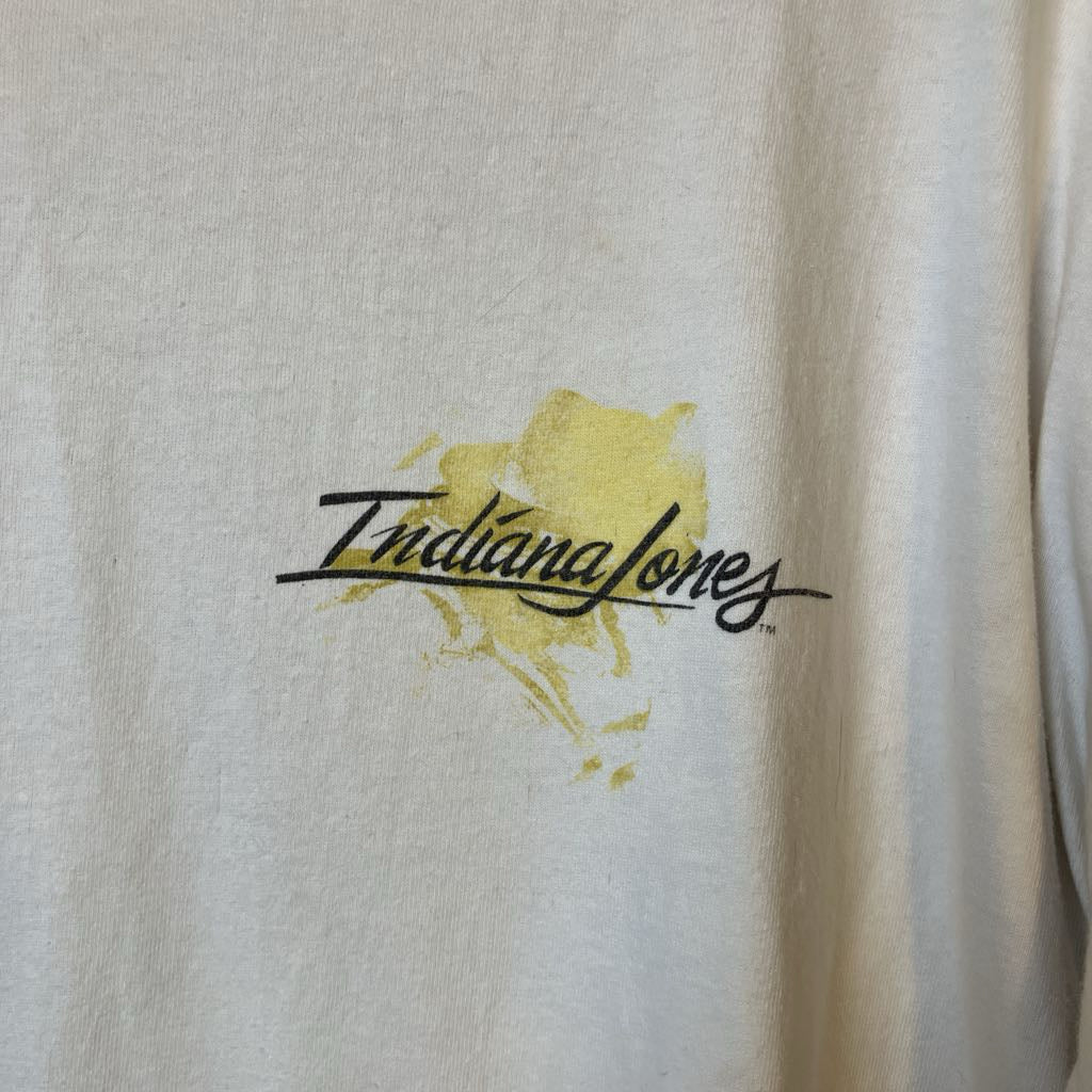 Beige fabric with 'Indiana Jones' logo in yellow and black