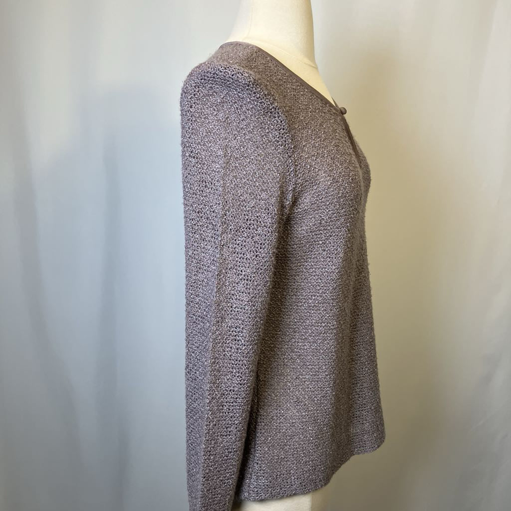 Mannequin wearing a textured gray sweater against a plain background