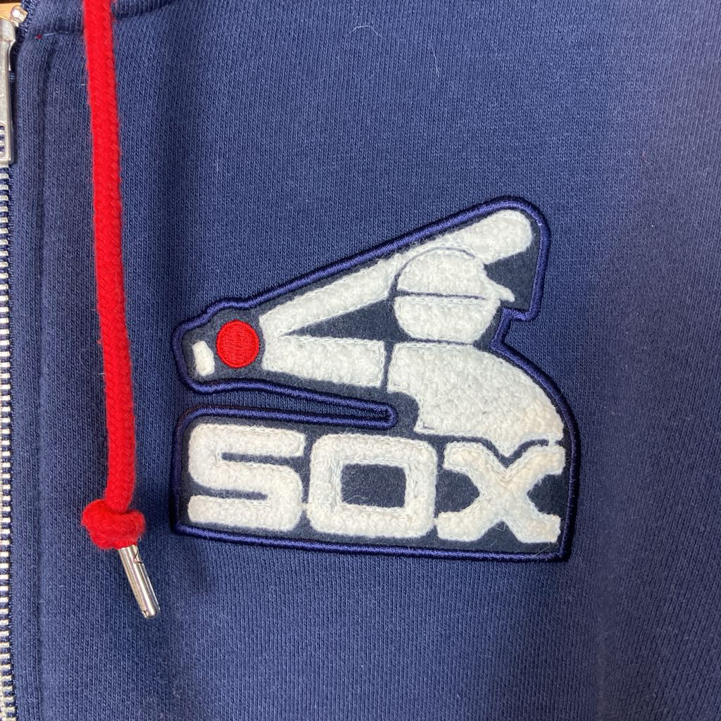 Navy blue jacket with a 'sox' logo featuring a baseball bat and ball on a red background.
