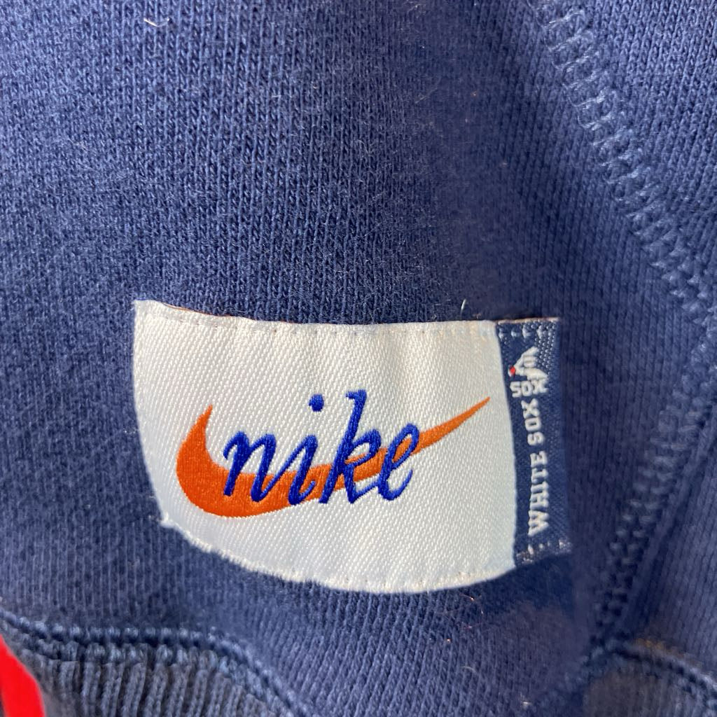 up close image of a nike label orange and blue and white