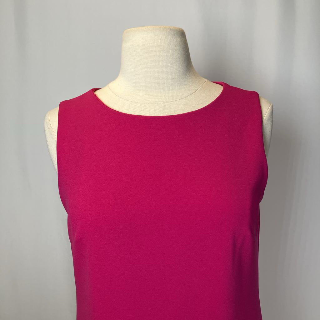 Pink sleeveless top on a mannequin against a plain background