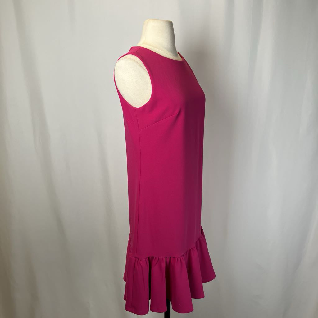 Pink dress on a mannequin against a white background
