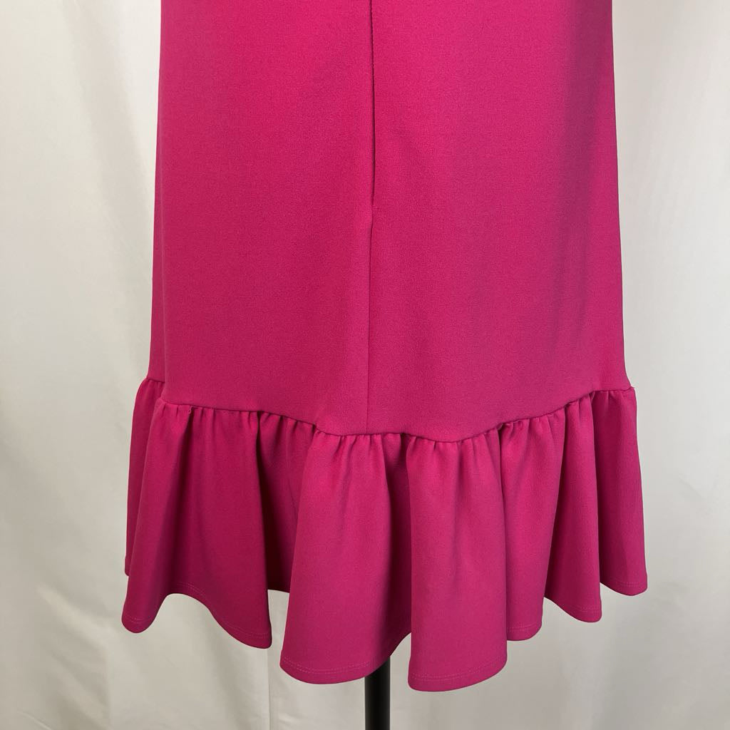 Pink drop waist dress on a mannequin against a white background.