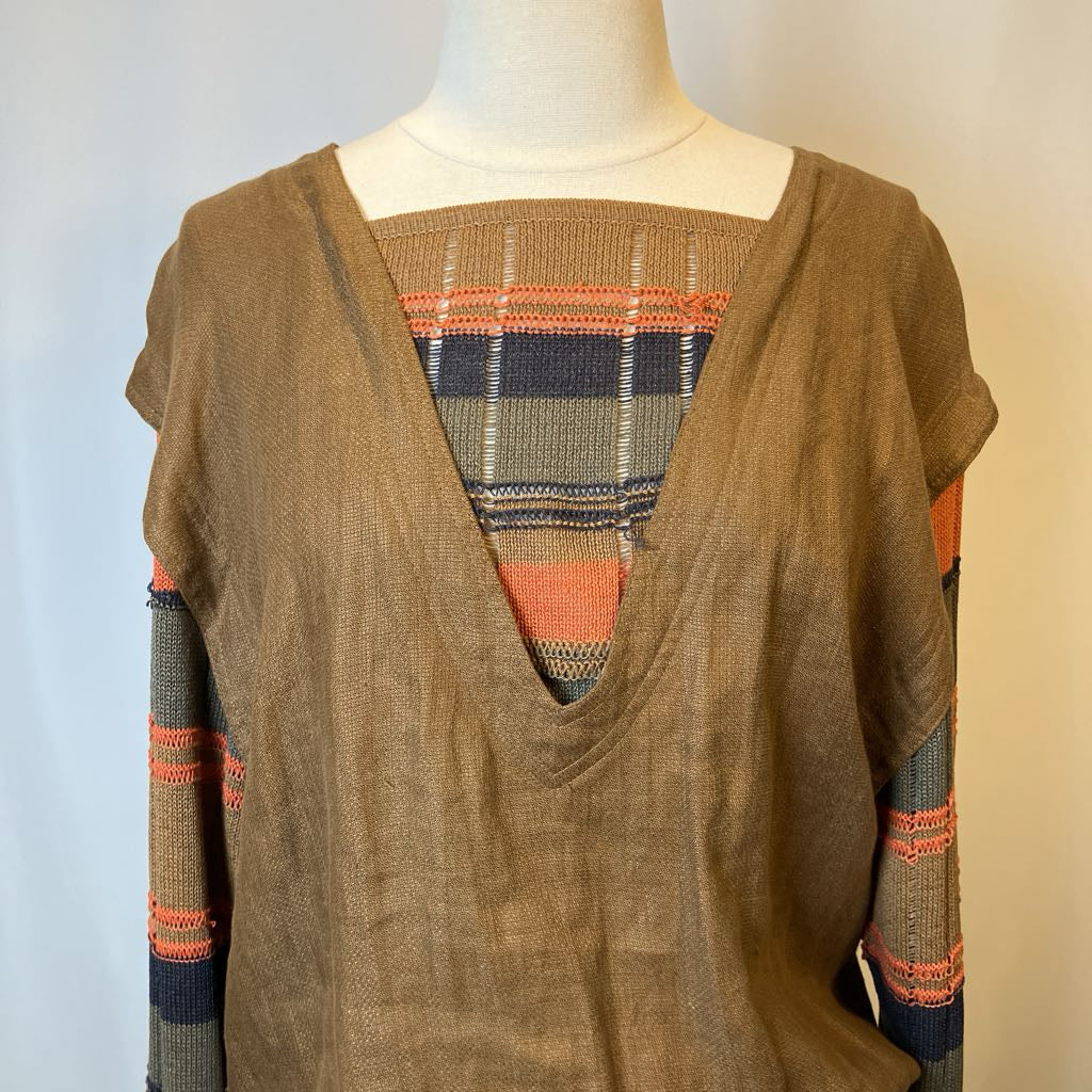 Brown sweater with colorful pattern on a mannequin against a plain background