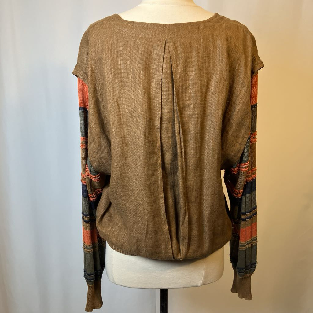 Brown long-sleeve shirt with plaid sleeves on a mannequin against a plain background