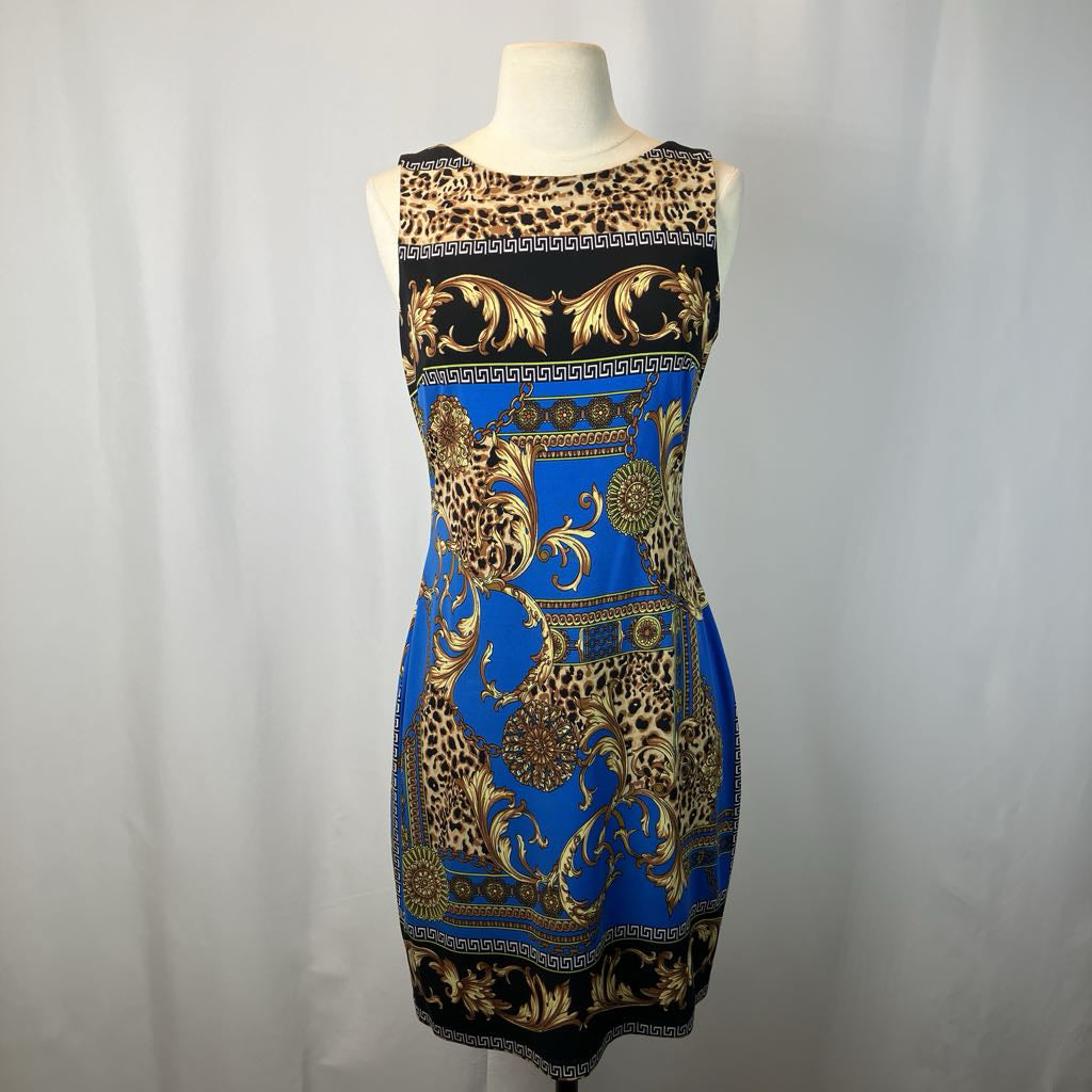 Dress with leopard print and baroque patterns on a mannequin against a plain background