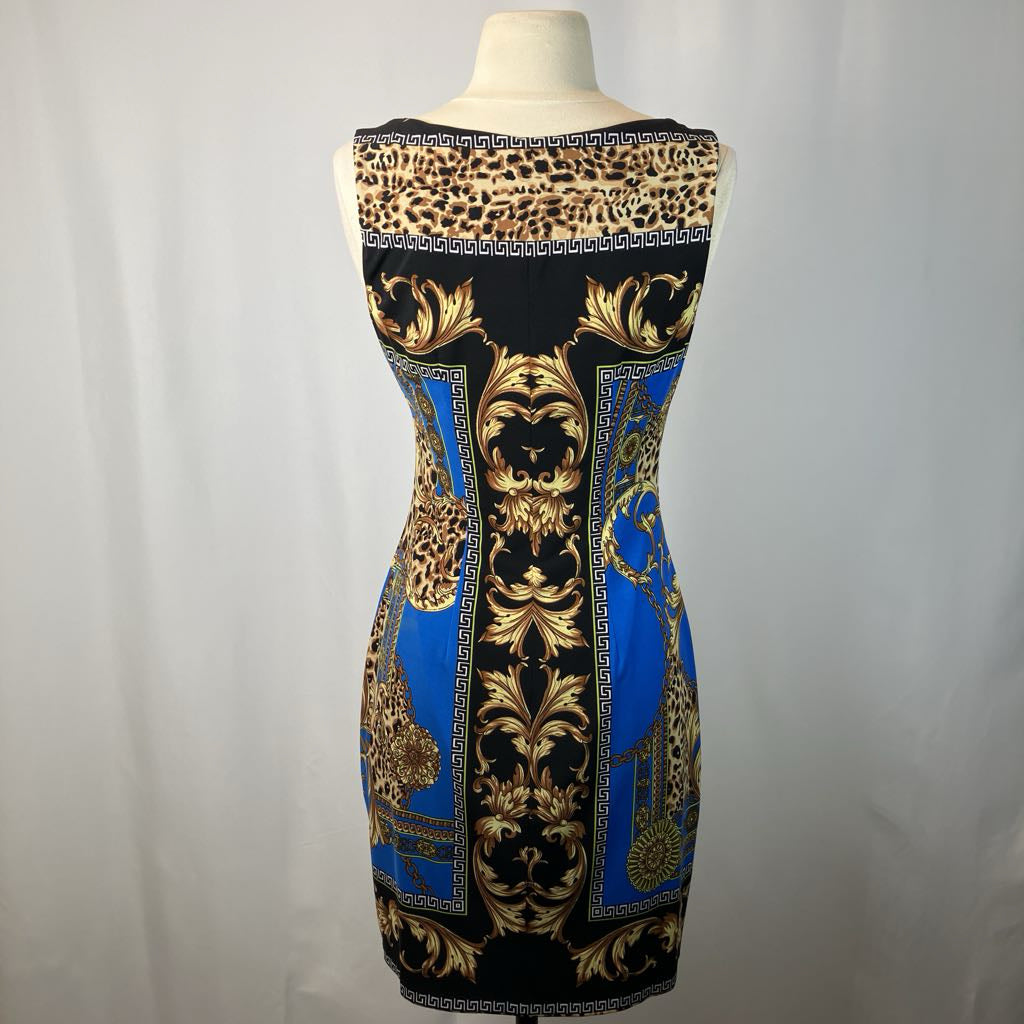 Dress with leopard print and baroque pattern on a mannequin against a white background