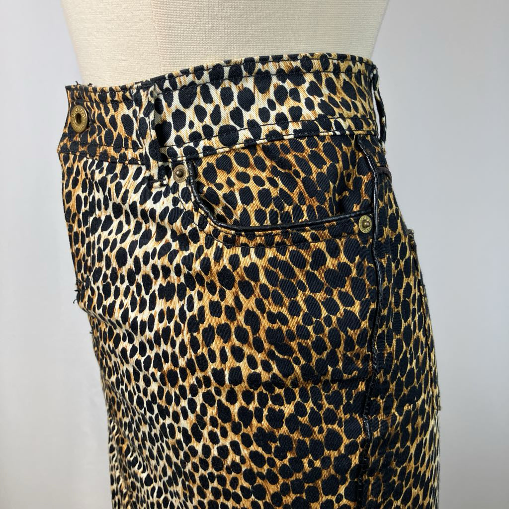 Leopard print pants on a mannequin against a plain background