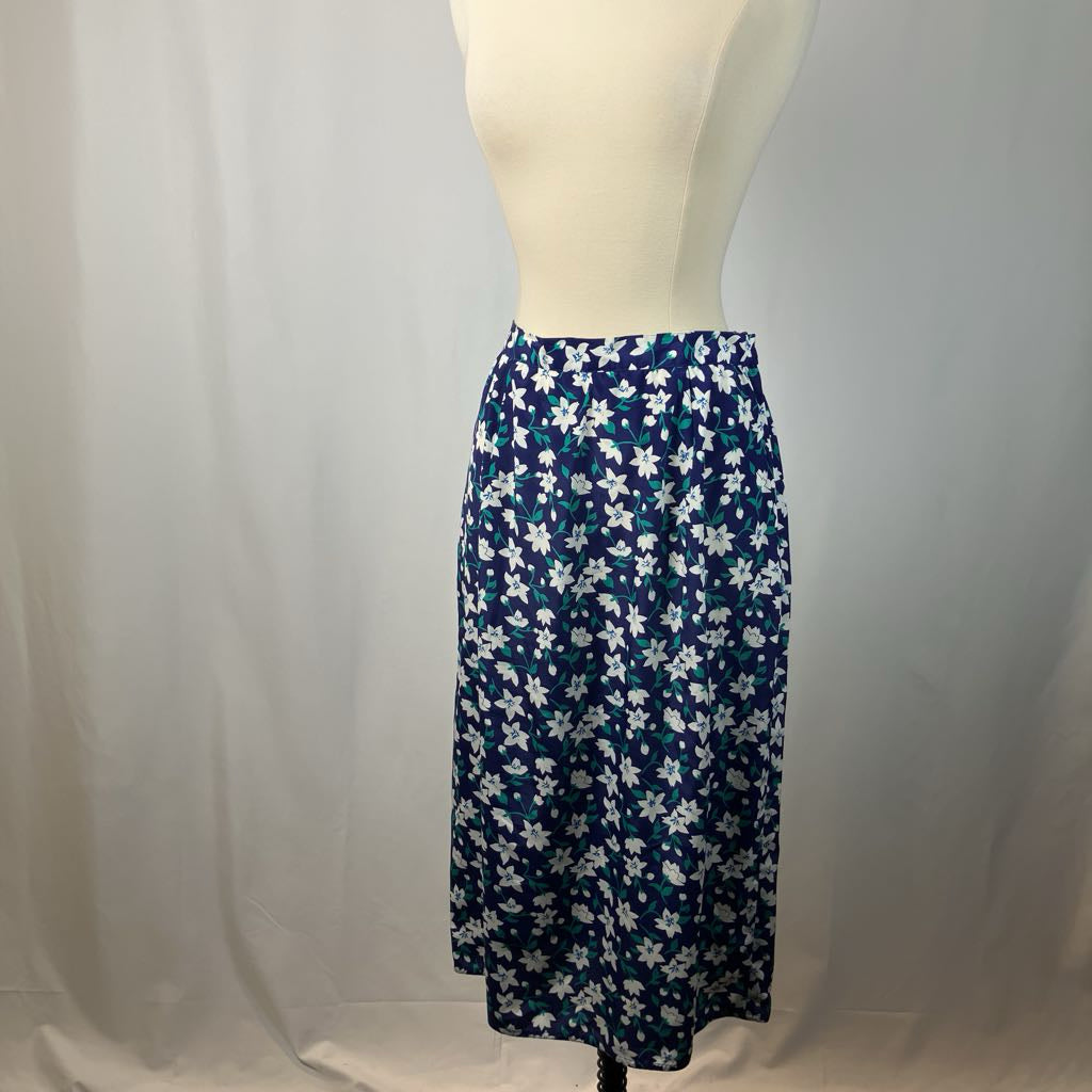 Blue floral skirt on a mannequin against a white background