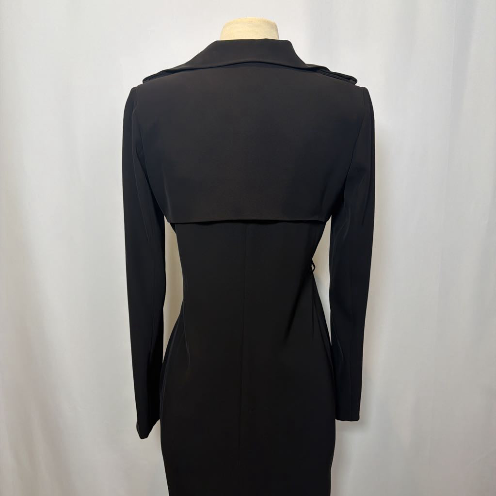 Black coat dress on a mannequin against a white background