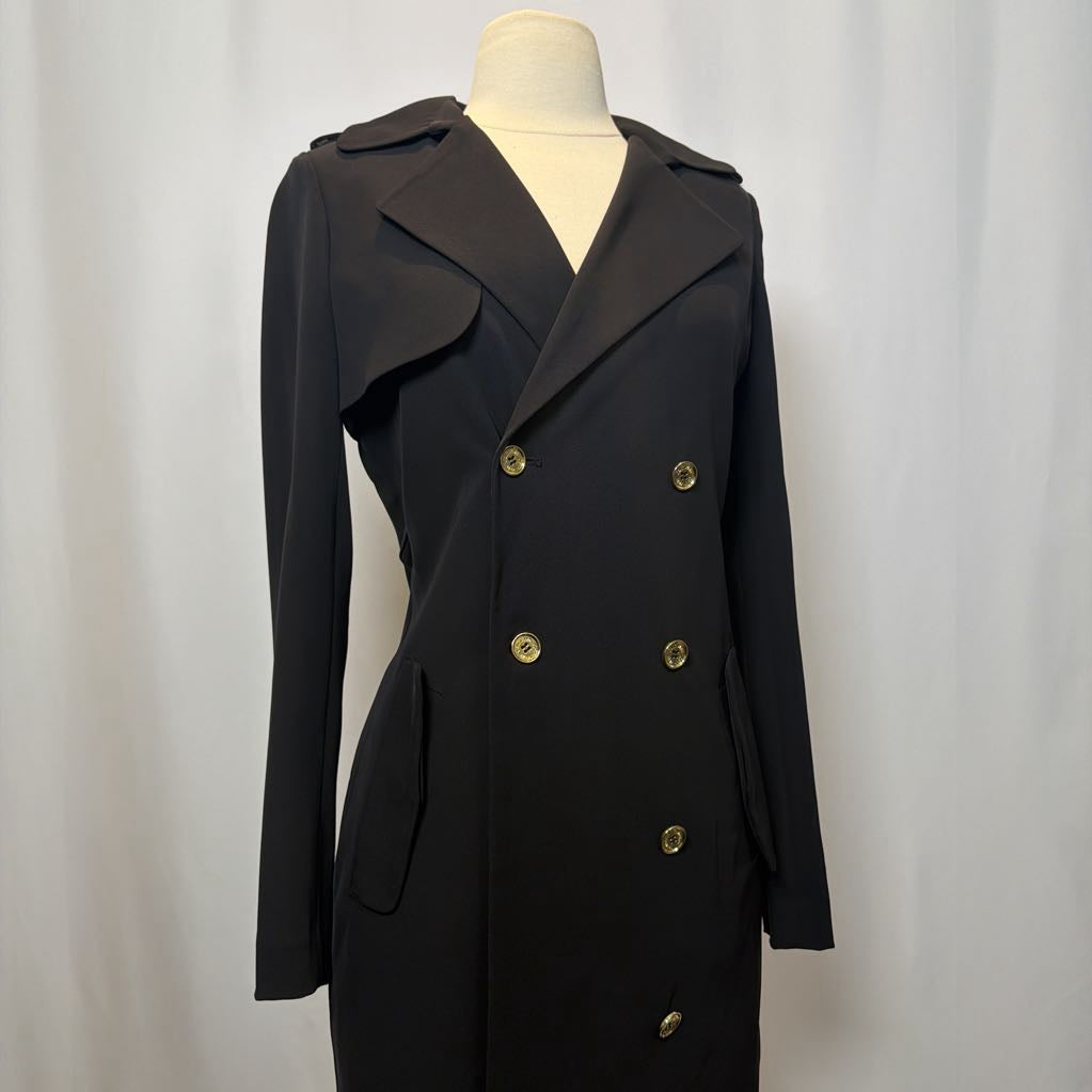 Black coat dress with gold buttons on a mannequin against a white background