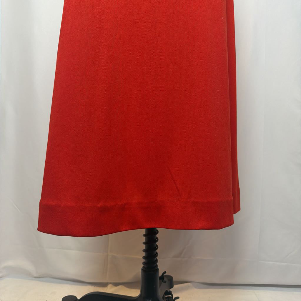 Red skirt on a mannequin against a white background