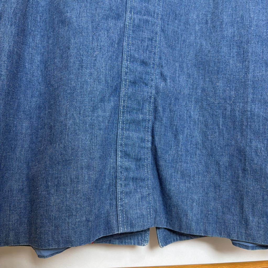 Close-up of blue denim fabric on a white background