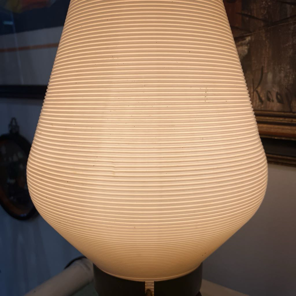 Textured lamp with a warm glow in an indoor setting