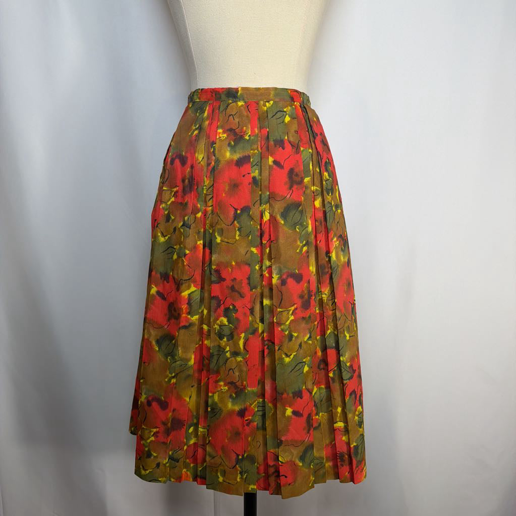 Floral patterned skirt on a mannequin against a plain background