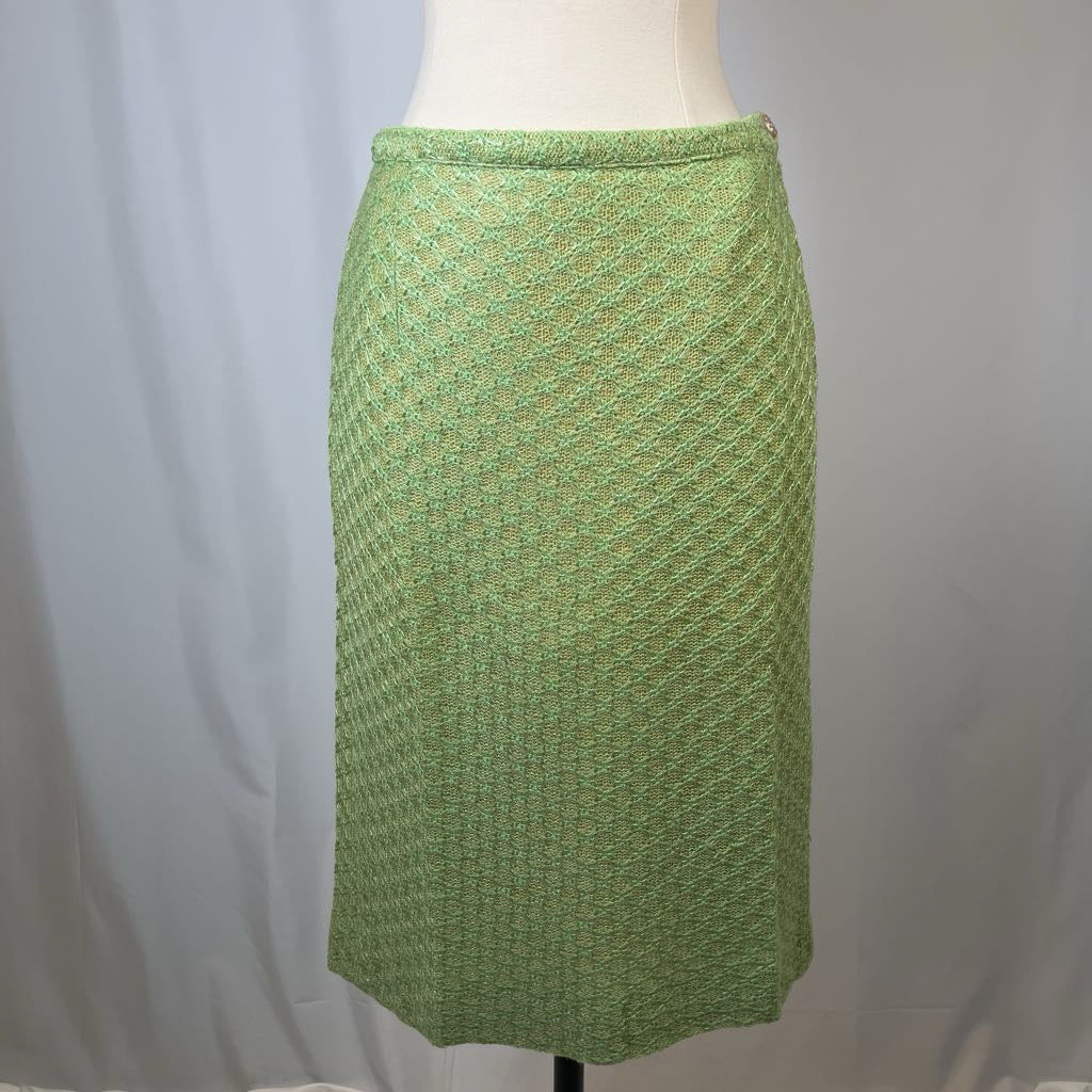 Green patterned skirt on a mannequin against a plain background