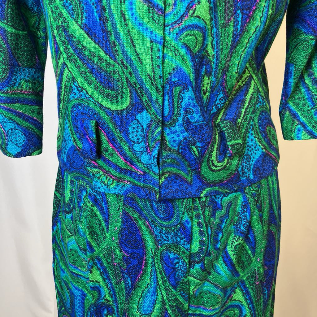 Blue and green patterned dress on a plain background