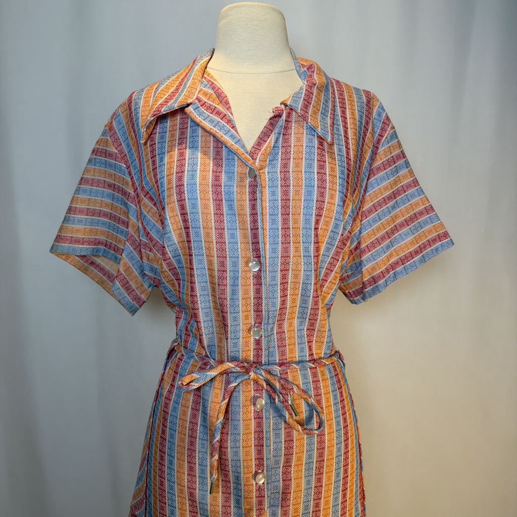 Multicolored striped dress on a mannequin against a neutral background