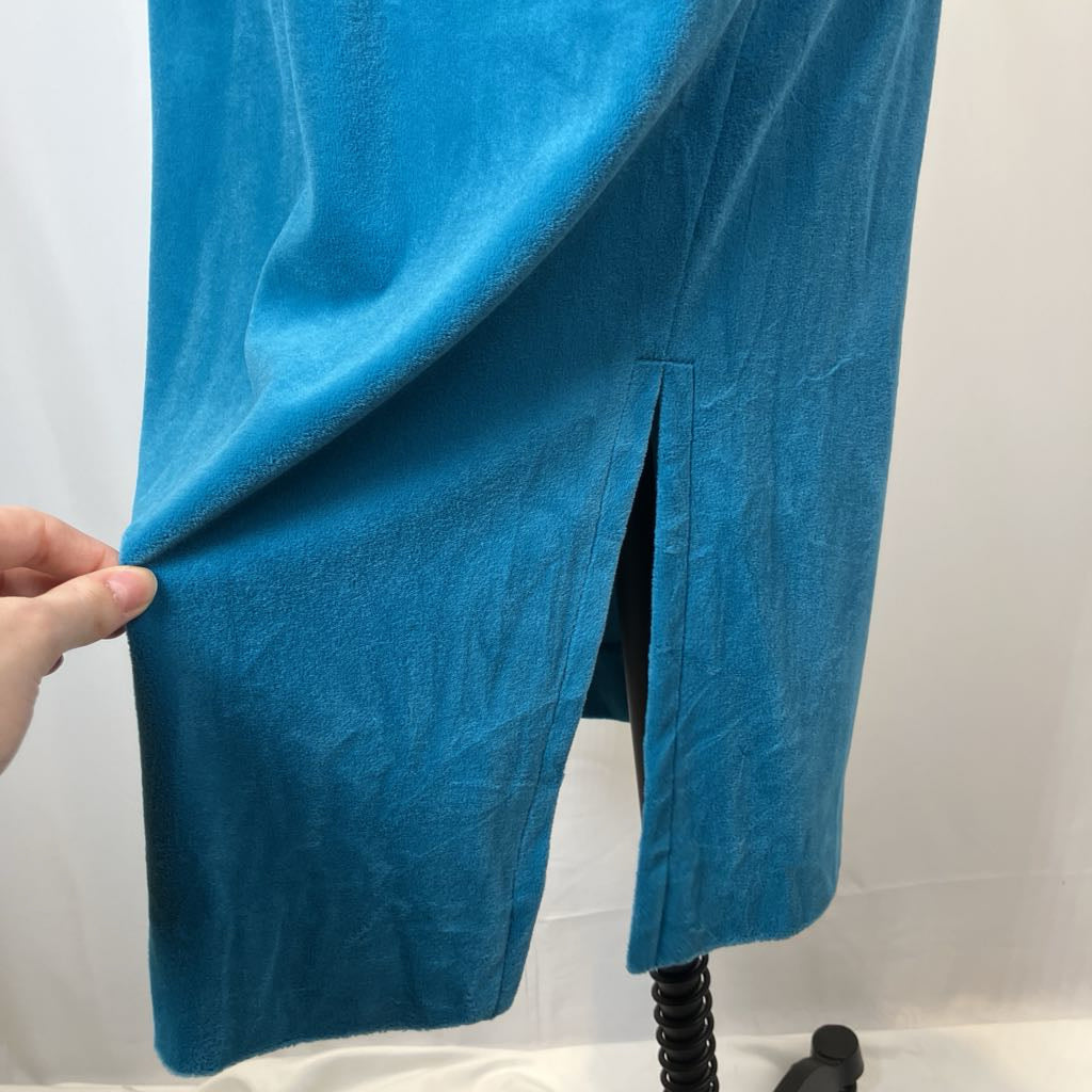 Blue fabric draped over a chair against a white background