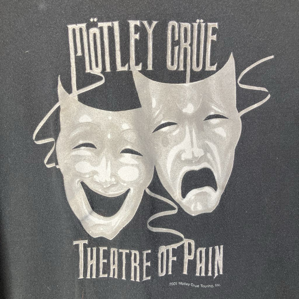 T-shirt with Mötley Crüe 'Theatre of Pain' design featuring masks on a dark background.