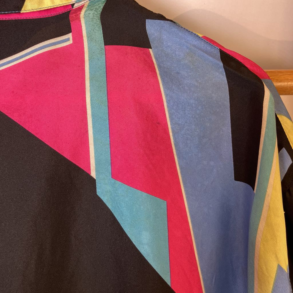 Colorful geometric patterned fabric with black background