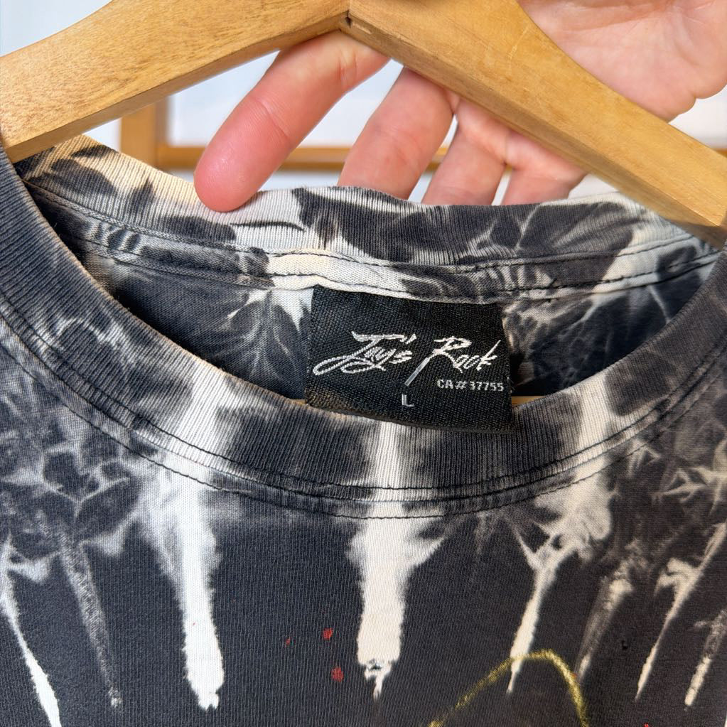 Tie-dye shirt with a brand label on a hanger