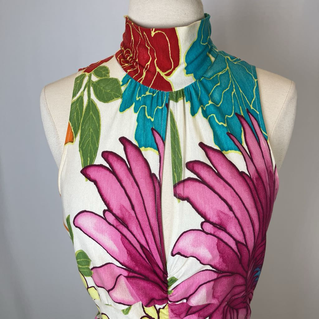 Colorful floral sleeveless top on a mannequin against a gray background