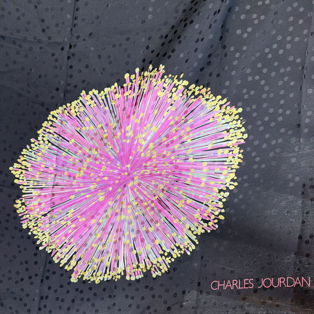 Decorative print with pink and yellow spikes on a dark fabric background, featuring the brand 'Charles Jourdan'.