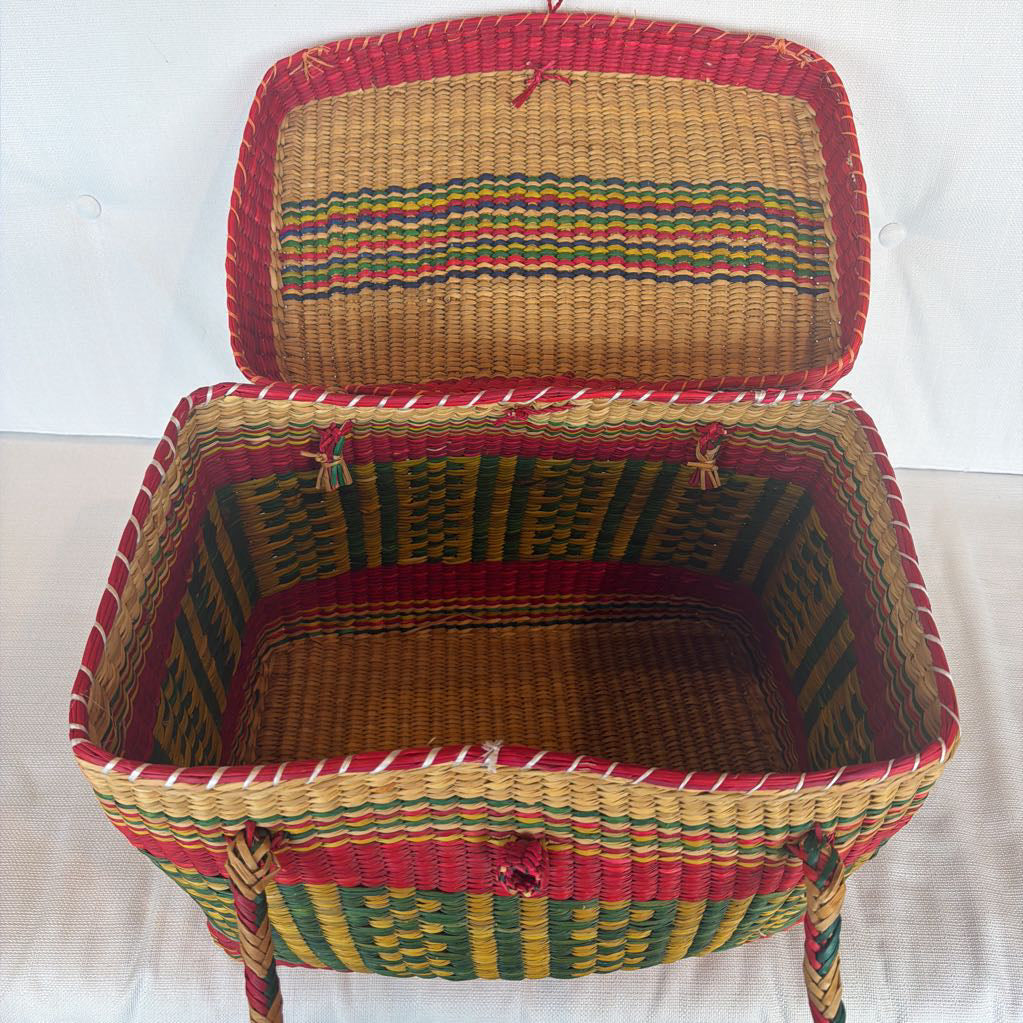 Woven basket with colorful striped pattern on a white background