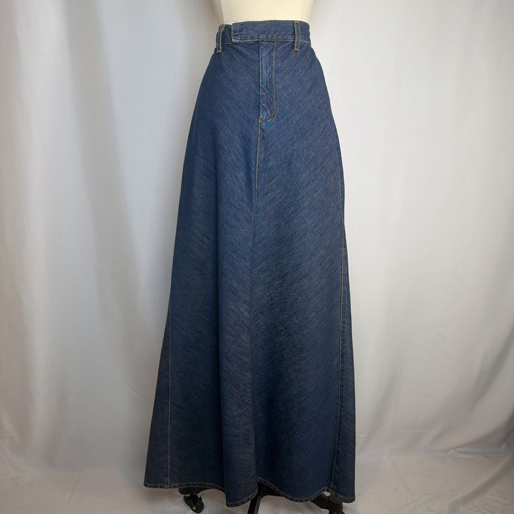 Blue denim skirt on a mannequin against a white background