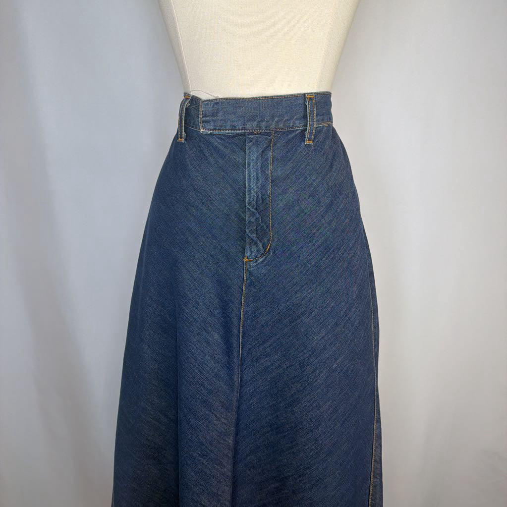 Blue denim skirt on a mannequin against a plain background