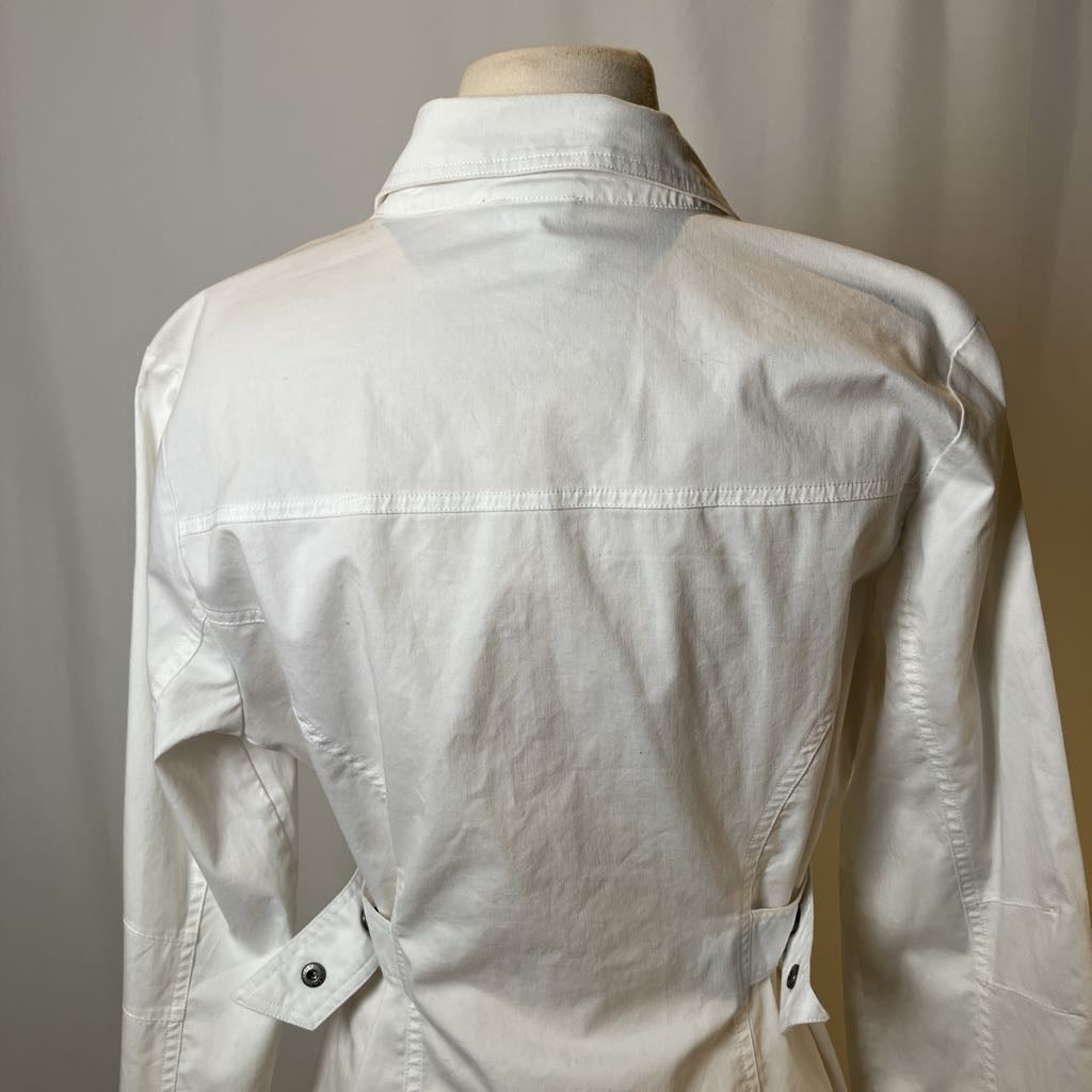 White jacket on a mannequin against a plain background