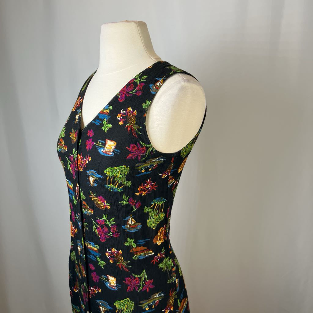 Mannequin wearing a sleeveless dress with colorful animal print on a plain background