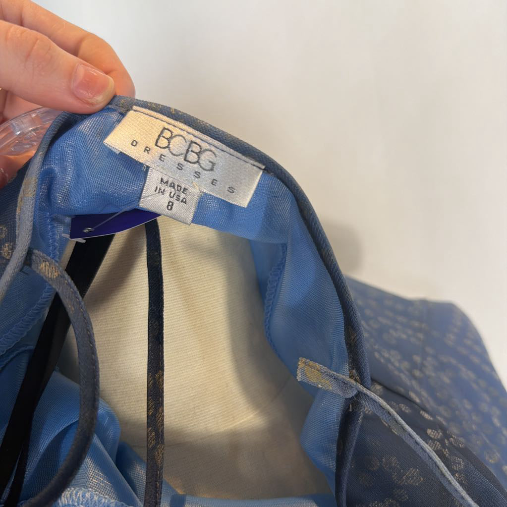 Blue dress with a visible label on a white background