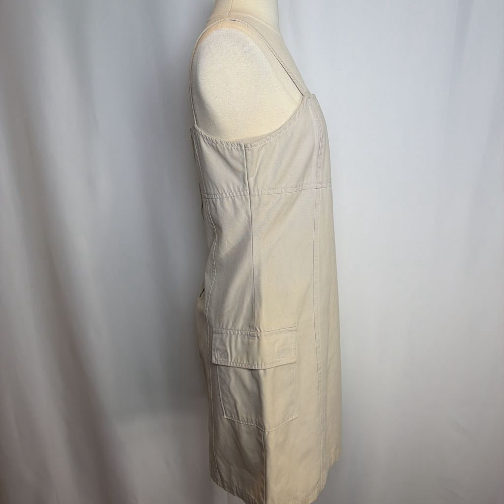 Beige dress on a mannequin against a white background