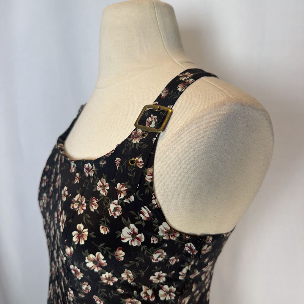 Floral dress on a mannequin with a plain background