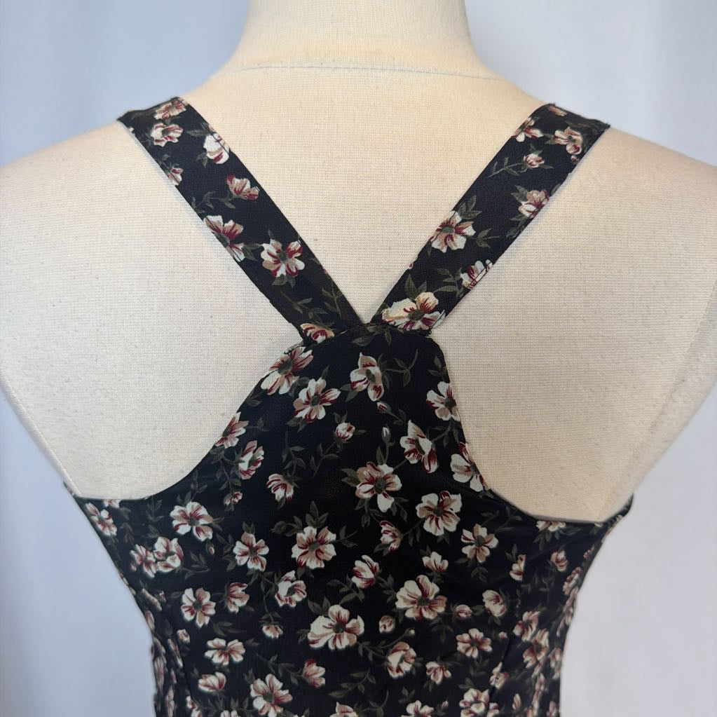 Floral patterned dress on a mannequin with a light gray background