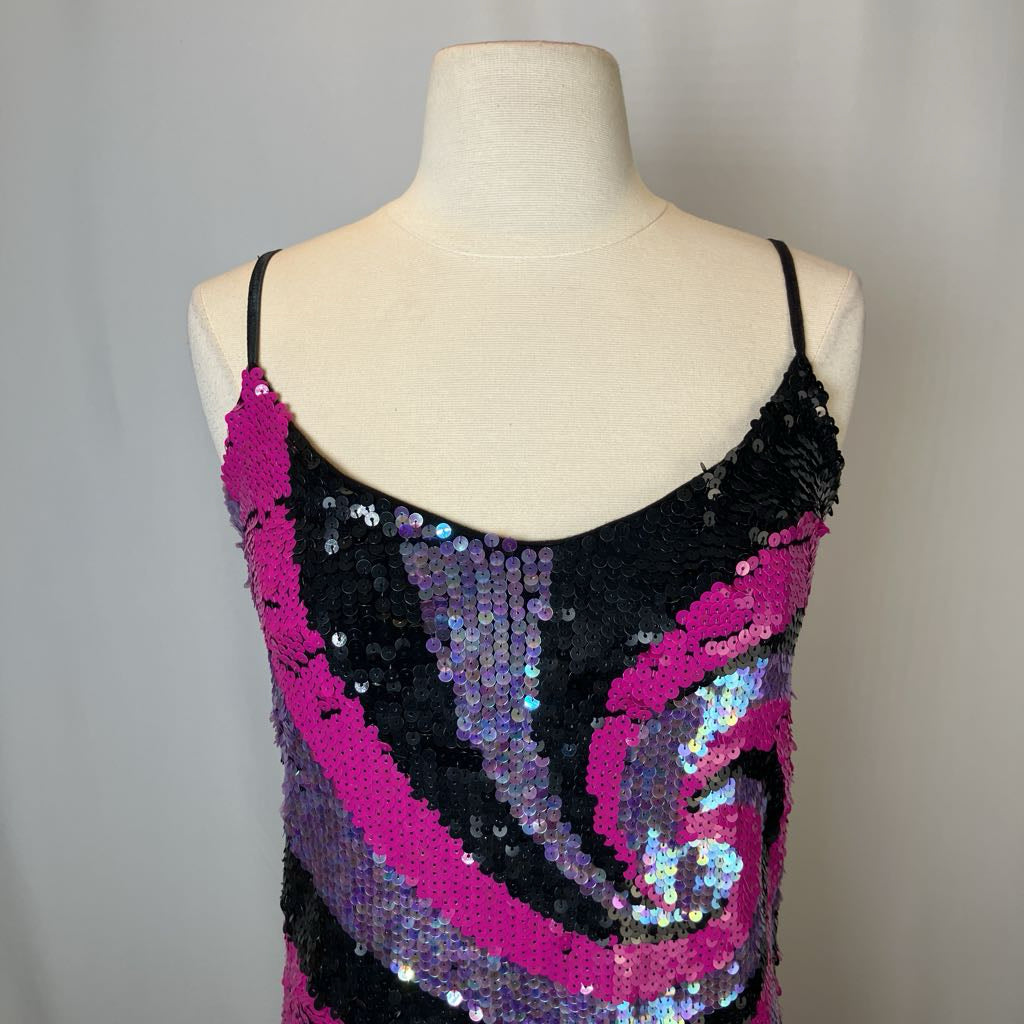 Mannequin wearing a sequined dress with pink and black pattern on a gray background